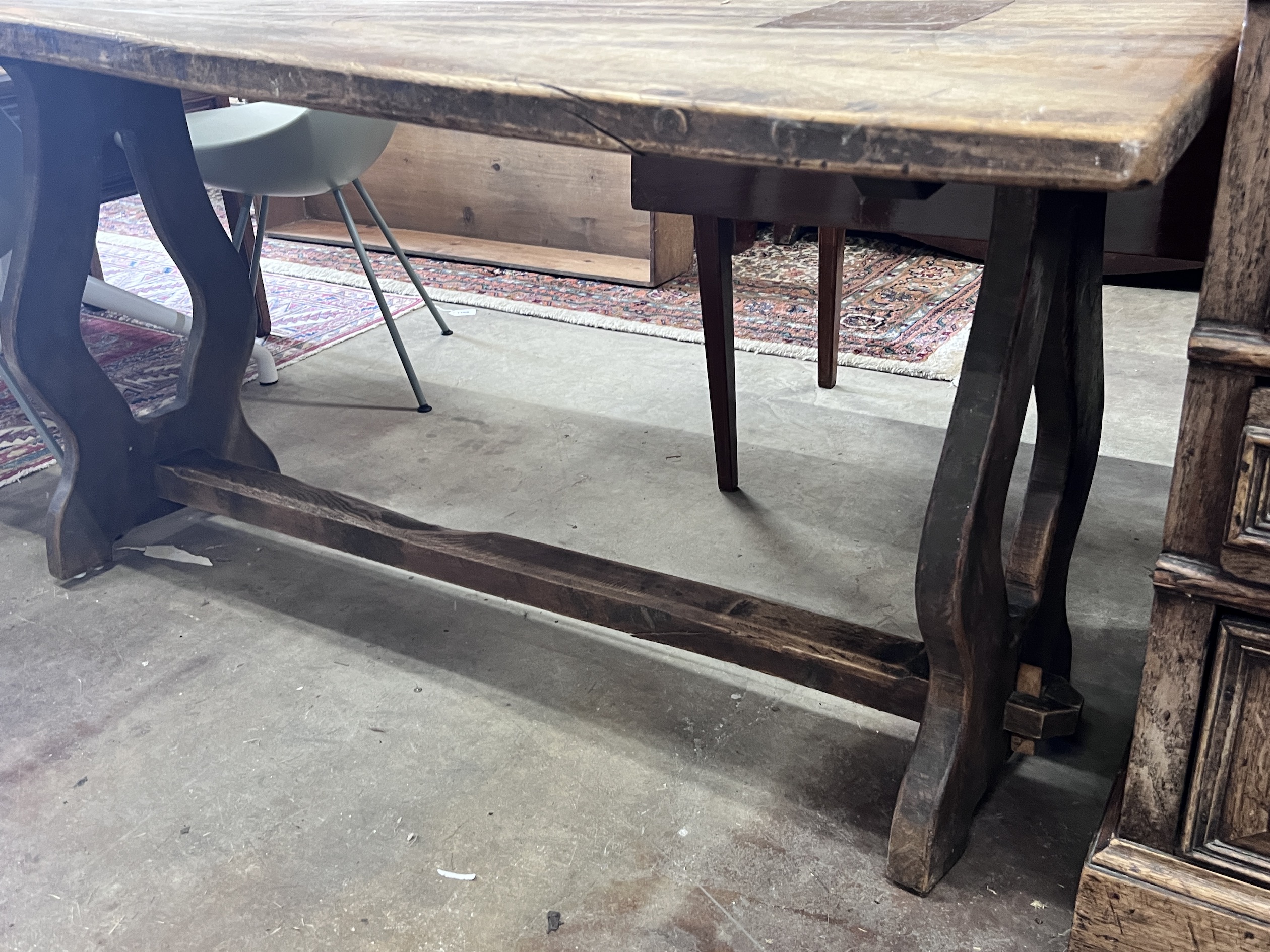 A small 18th century style rectangular elm refectory table, length 137cm, depth 64cm, height 70cm (severely warped)